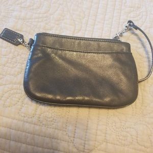 Leather Coach wristlet.